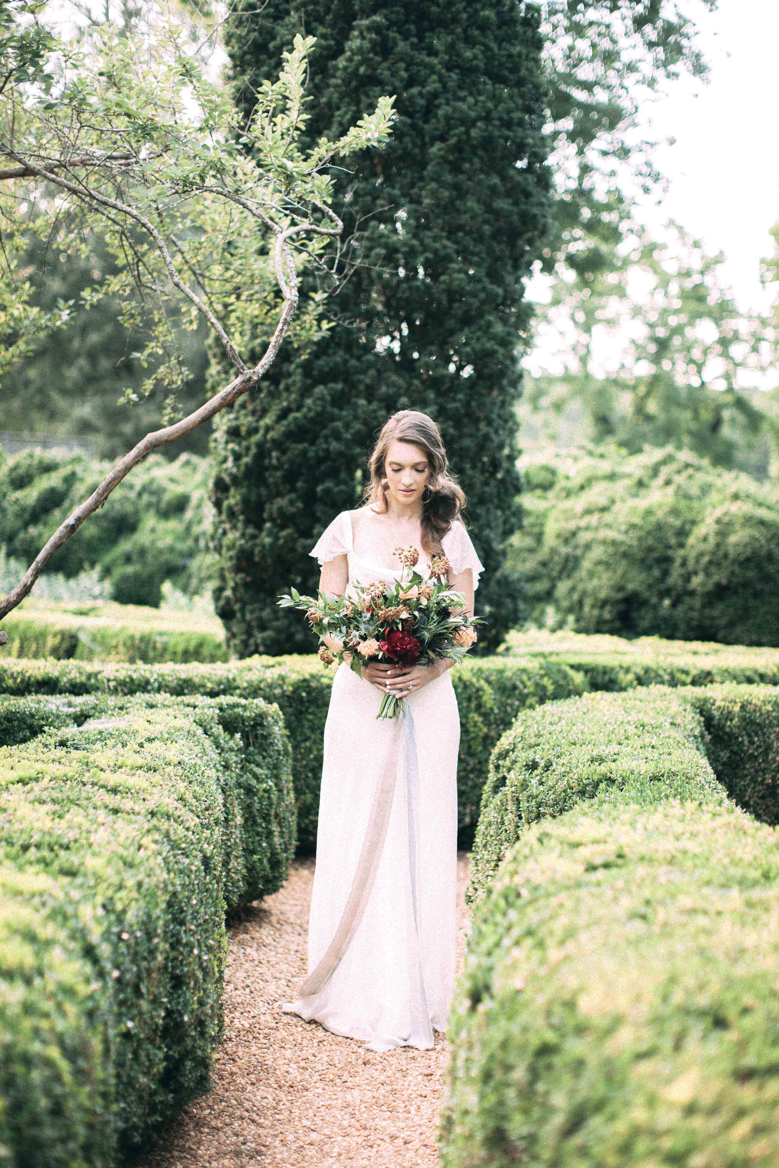 Bride in Chiffon long dress and wild bouquet