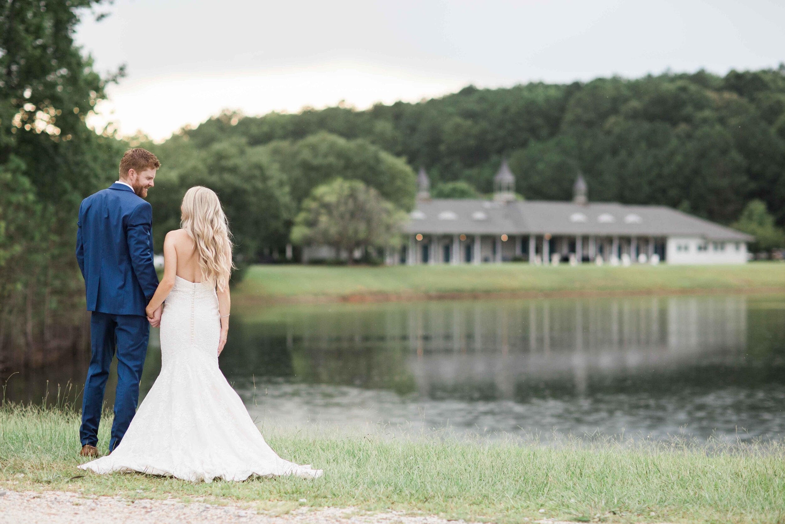 Bride and groom standing in front of foxhall wedding venue