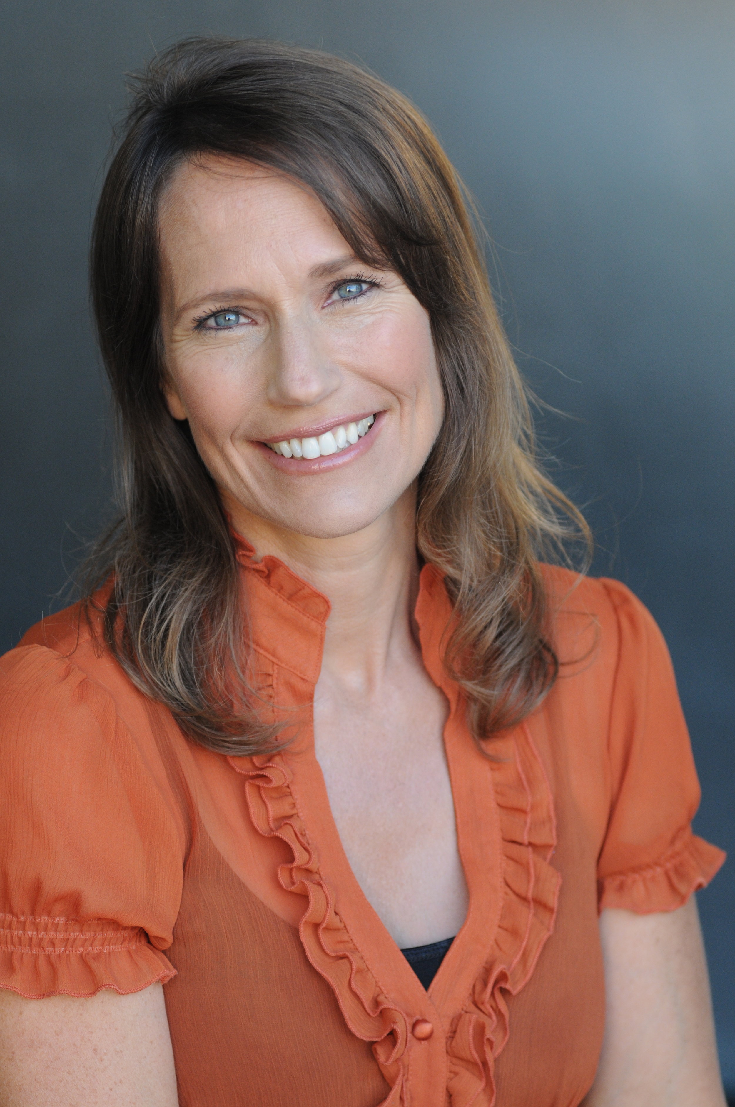 kathy_fettke_orange_shirt_straight.jpeg