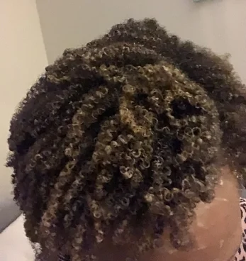Hair with Bentonite clay mask applied.