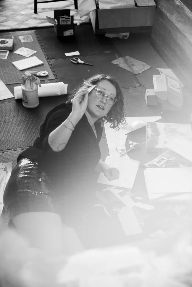 artist shows object in studio