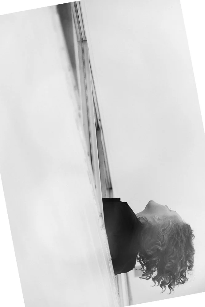 woman leaning out window