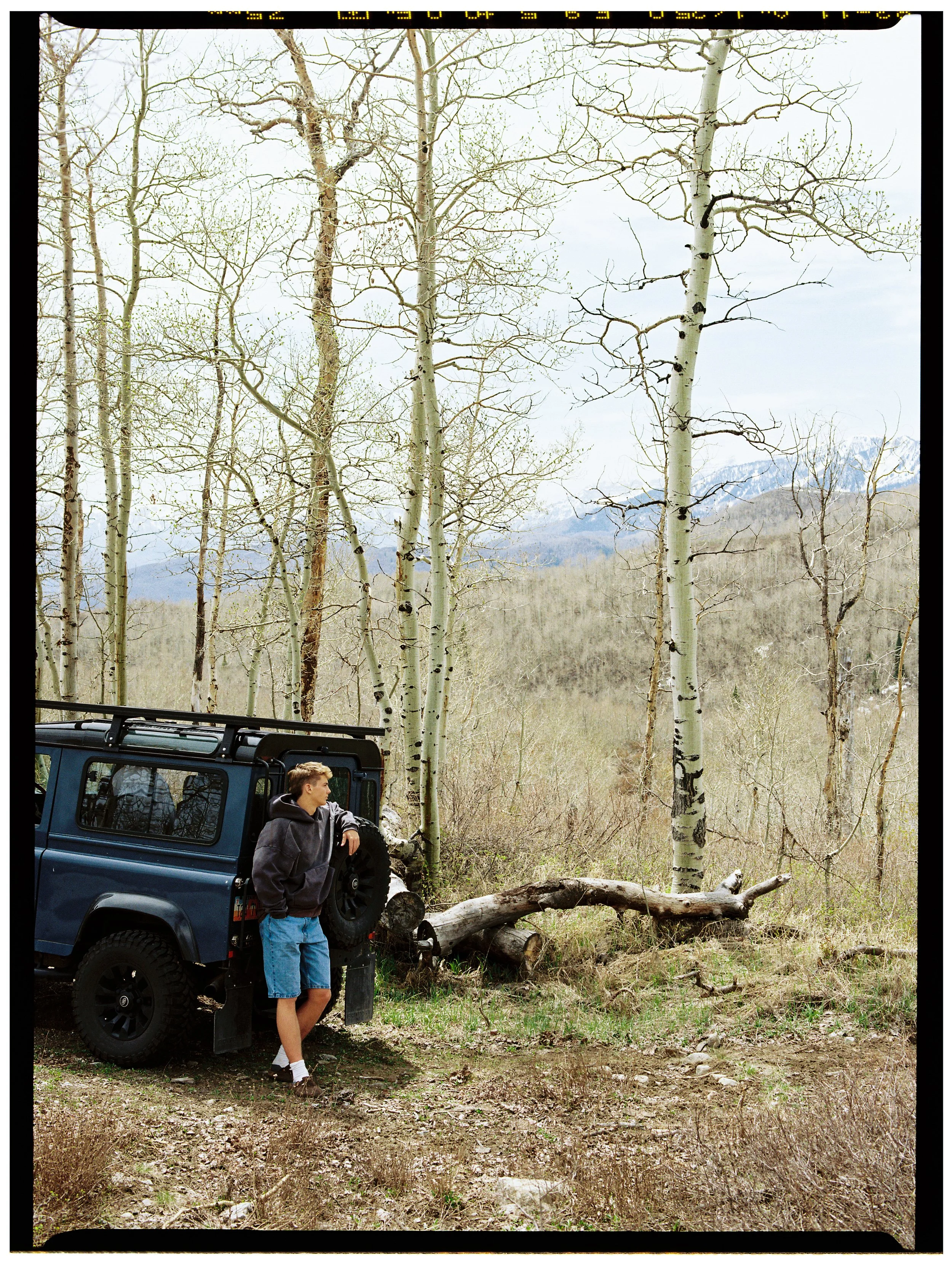 portrait of kid with vintage toyota defender