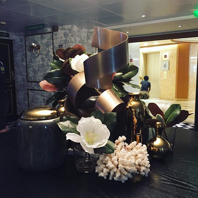 Display table styling by moi for the #pacificexplorer flag ship of #carnivalaustralia P&amp;O fleet. #brass details mixed with #white magnolias #treschic 😉 #homedesign #style #designporn #interiors #decorating #interiordesign #interiordecor #archite