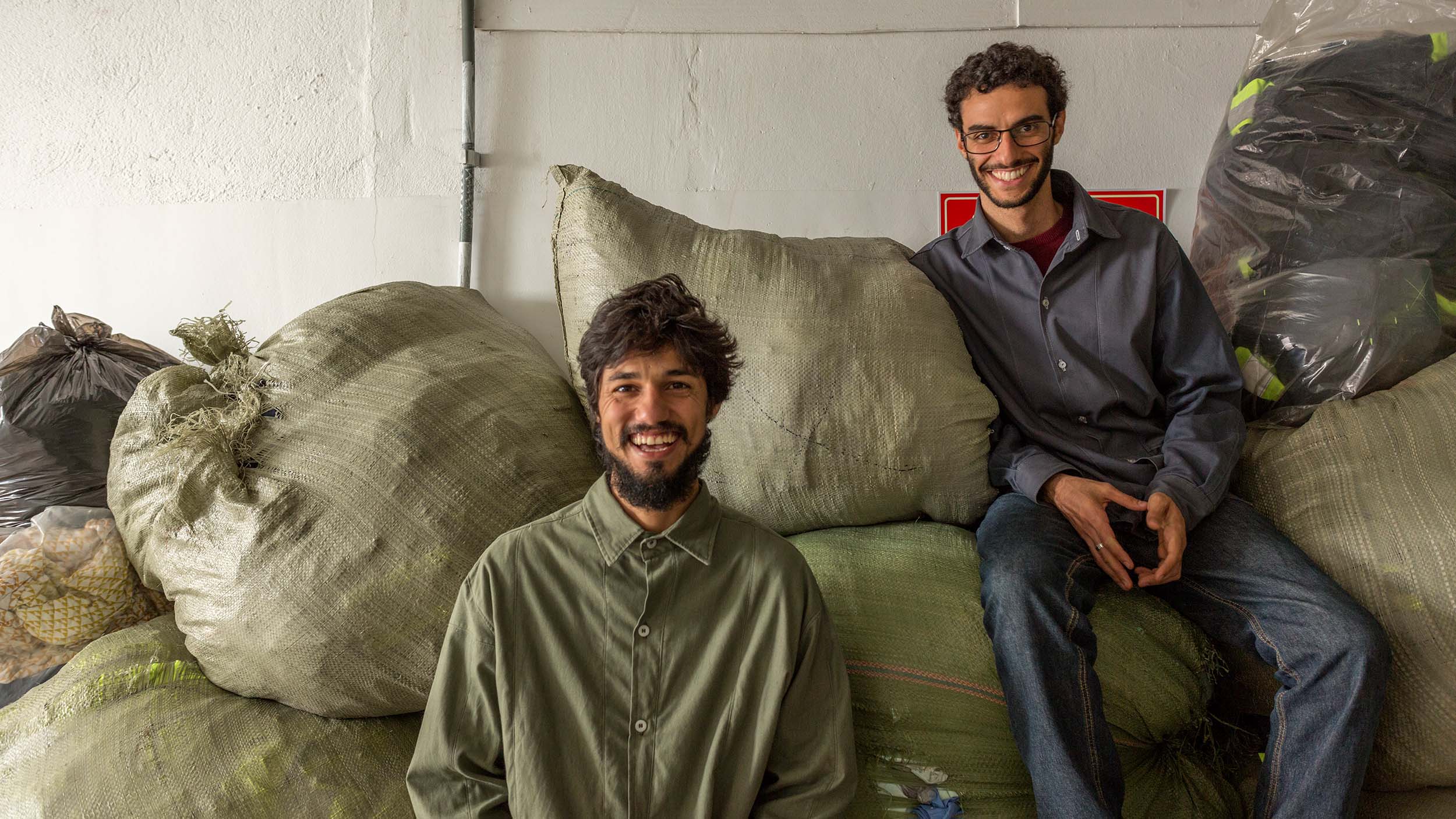 Retalhar Founders Lucas Corvacho (L) and Jonah Lessa (R) met while working in the impact reduction department at Lutha Uniformes, where they identified a market need for recycling used uniforms in Brazil.