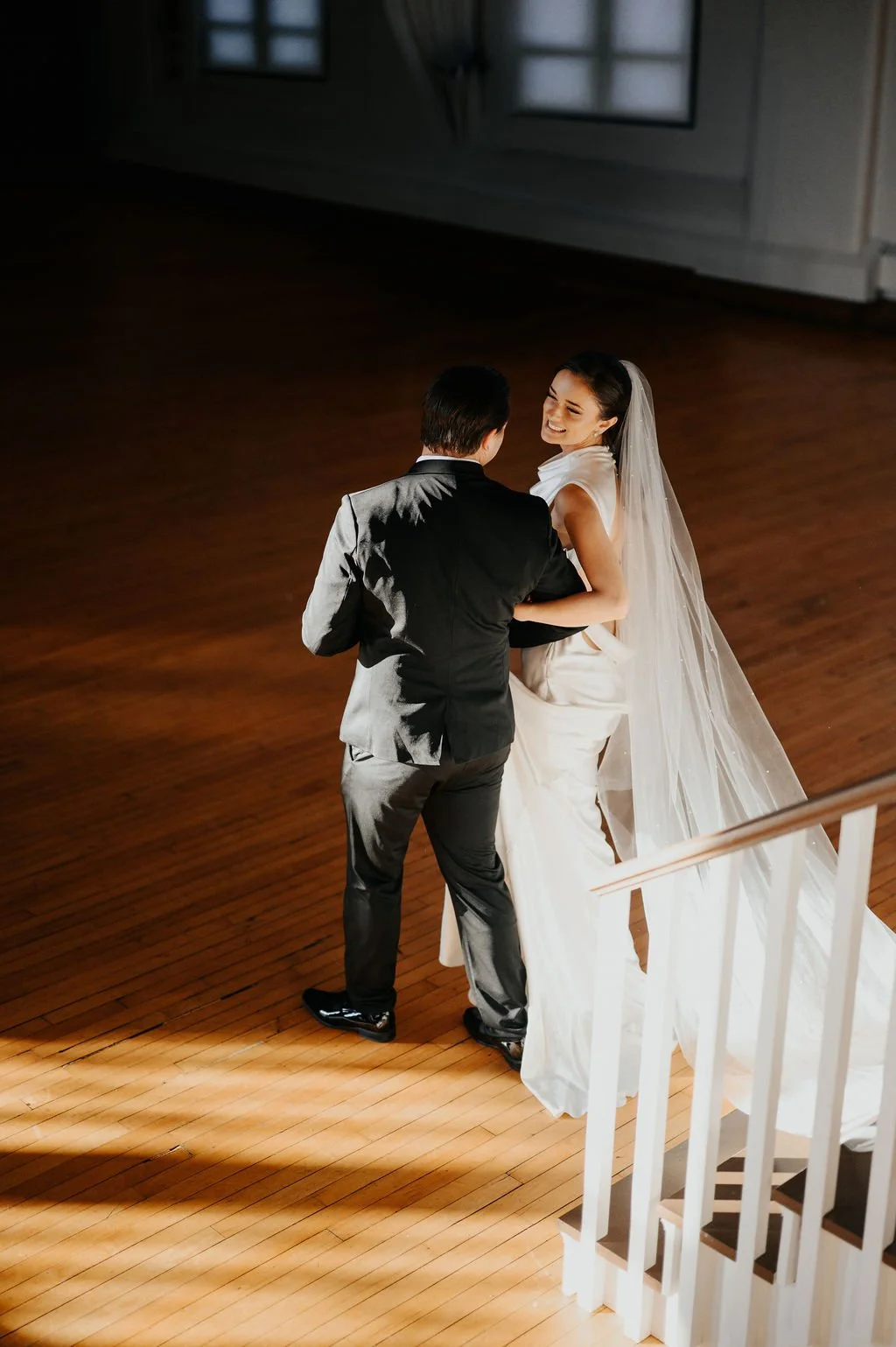 Bride and Groom Walking to the Ballroom Floor at The Historic German House.jpg