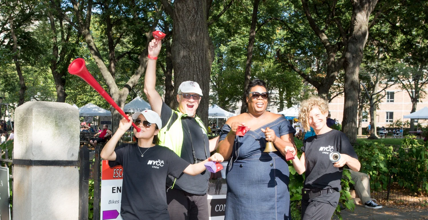 A group of volunteers posing to celebrate the Escape From New York cycling event