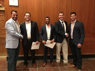 Board Members: Clayton Ramsey and Mark Priebe, with 2018 Salisbury University recipients. 