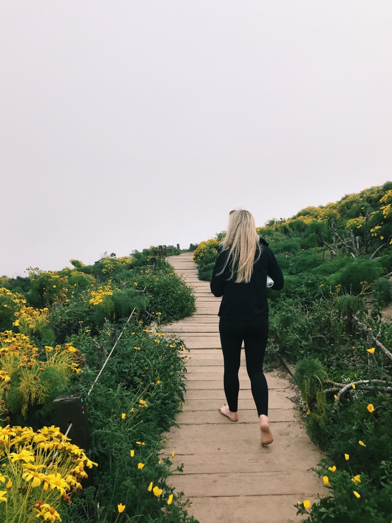  Lily Giedd, 20, saunters down the main trail at Point Dume, Malibu. 