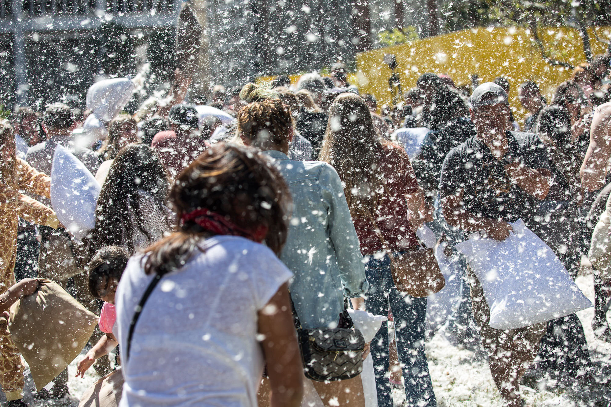  Participants take part in a giant pillow fight as feathers fly in Pershing Square in Downtown Los Angles on Saturday, April 1 2017. Hundreds of people traded soft blows in a giant pillow fight that dwarfed even the biggest slumber party slugfest. Th