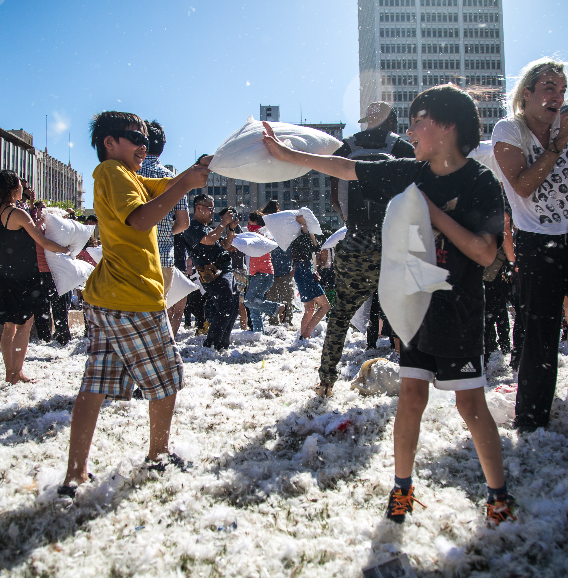  Two young pillow fight participants wage a pillow war on each other during the International Pillow Fight Day in Pershing Square in Downtown Los Angles on Saturday, April 1 2017. Hundreds of people traded soft blows in a giant pillow fight that dwar