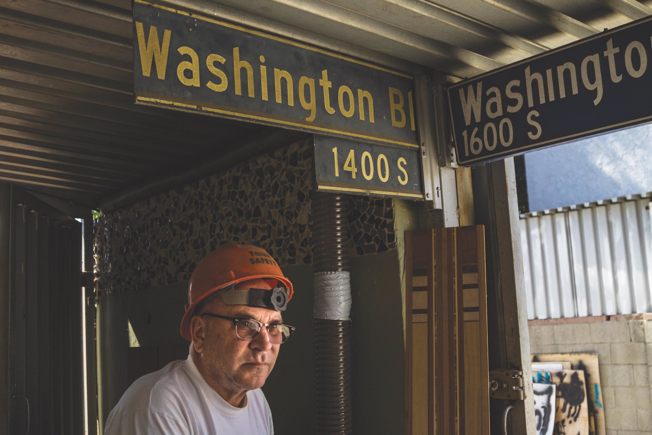  Kevin. J Brunk, 56, ret. builder, developer, activist and artist in his workshop at his home in Marina Del Rey, CA, Friday September 16th, 2016. Brunk is photographed with the original West Washington Blvd sign as he was responsible for spearheading