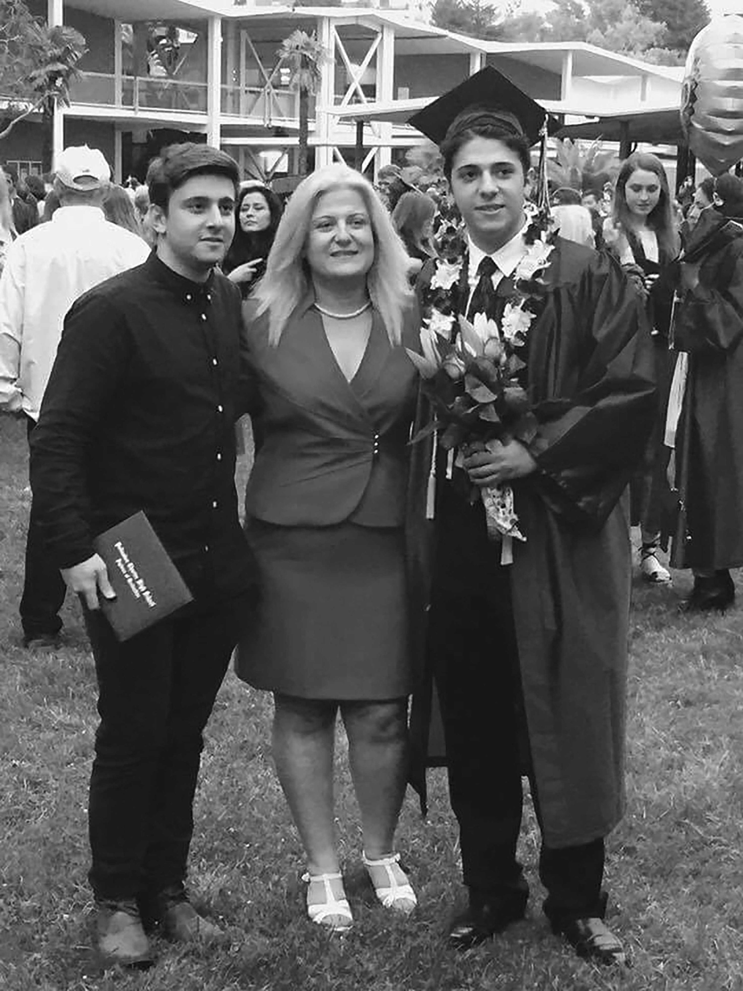  Faten Safadi (center) embraces her sons Wail Safadi (Left) and William Safadi (right) during William’s High School graduation from Pacific Palisades High School in June of 2016 in Pacific Palisades, CA. 