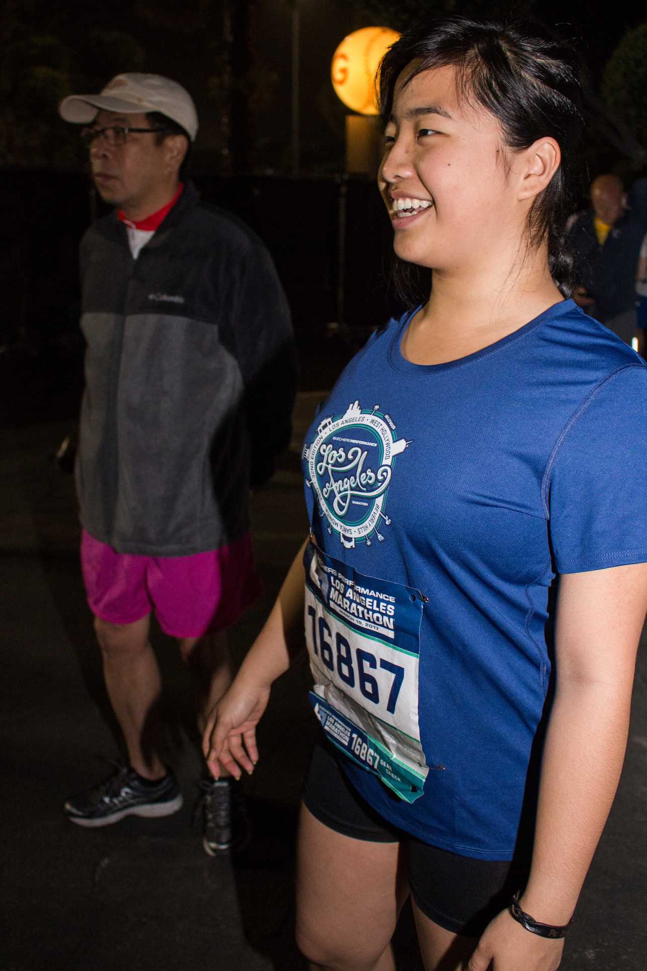  Santa Monica College Acssociated Students Activities Director, Kathy Pho (right) and her father Que Pho (left) converses with thei family as she prepares for the 2017 Skechers Performance LA Marathon on Sunday March 19, 2017 at the Dodger Stadium in