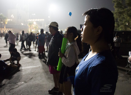  Santa Monica College Acssociated Students Activities Director, Kathy Pho (right), her younger sister, Katrina Pho (middle), and her father, Que Pho (left), look out over the croud of runners and supported of the 2017 Skechers Performance LA Marathon