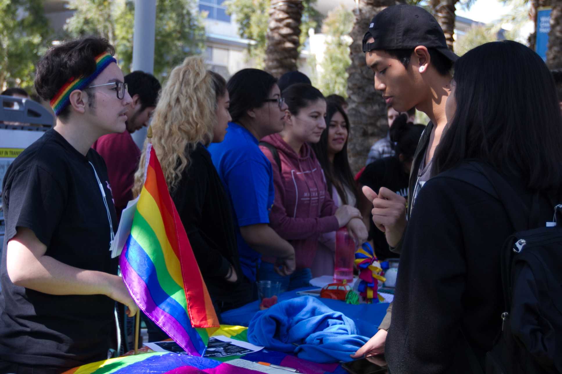  Mysterie Peña (left), president of the GSA talks to Tommy Pathammavong (right) about what he can expect upon joining the club at Club Awareness Day at Santa Monica College in Santa Monica California on March 14, 2017 (Photo By: Zane Meyer) 