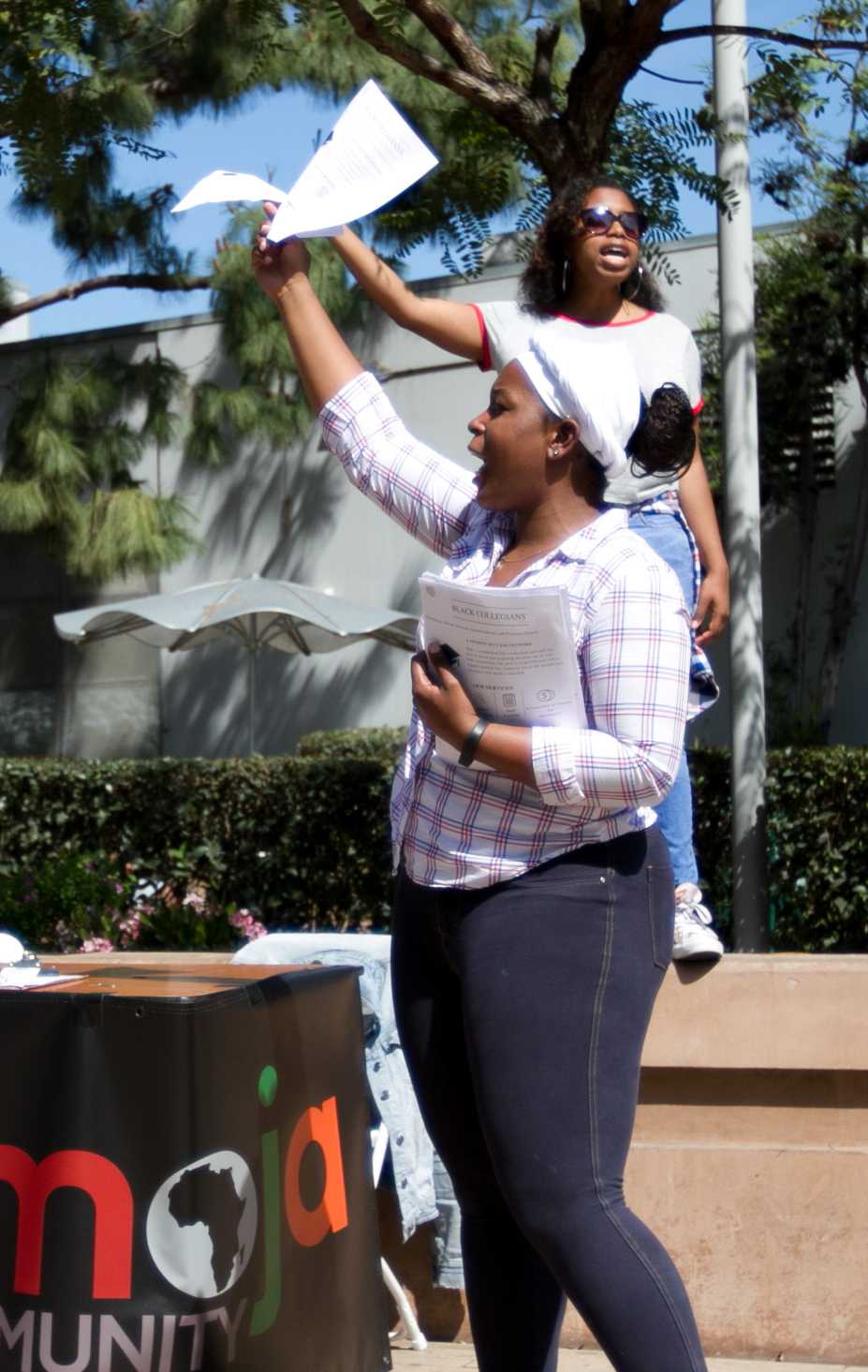  Black Collegians activity director Jessica Mebane (front), and Vice President Monique Muepo (back) recruit new members and spread awareness for their organization at Club Awareness Day at Santa Monica College in Santa Monica California on March 14, 