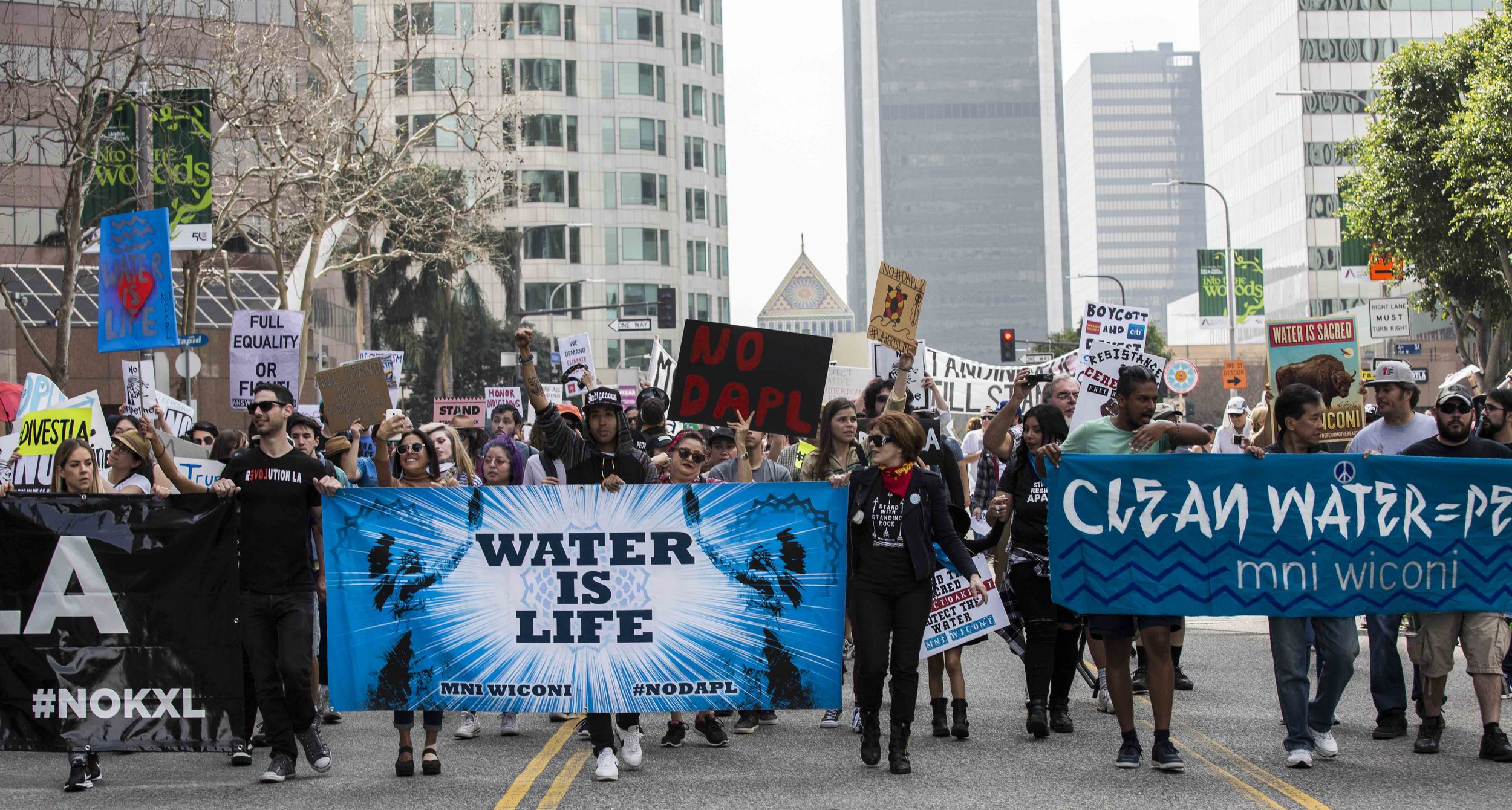  A coalition of activist groups carrying signs and chanting slogans march in opposition to the Dakota Access Pipeline in downtown Los Angeles Calif., on Friday, March 10, 2017. The group was calling on the city of Los Angeles to cut financial ties wi