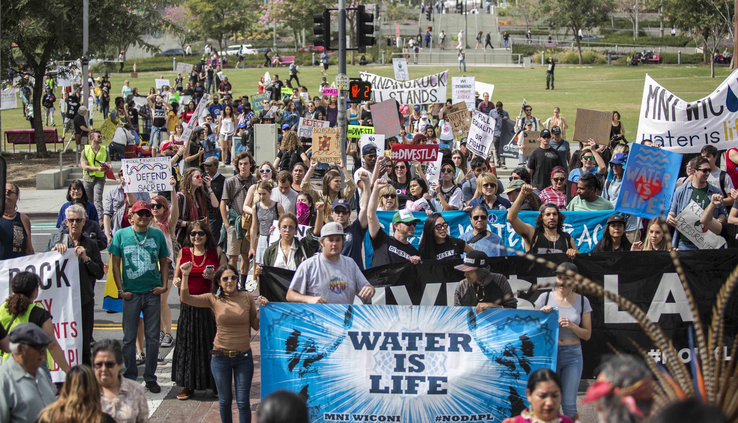  A coalition of activist groups carrying signs and chanting slogans who marched in opposition to the Dakota Access Pipeline finally arrive to Los Angles City Hall in downtown Los Angeles Calif., on Friday, March 10, 2017. The group was calling on the