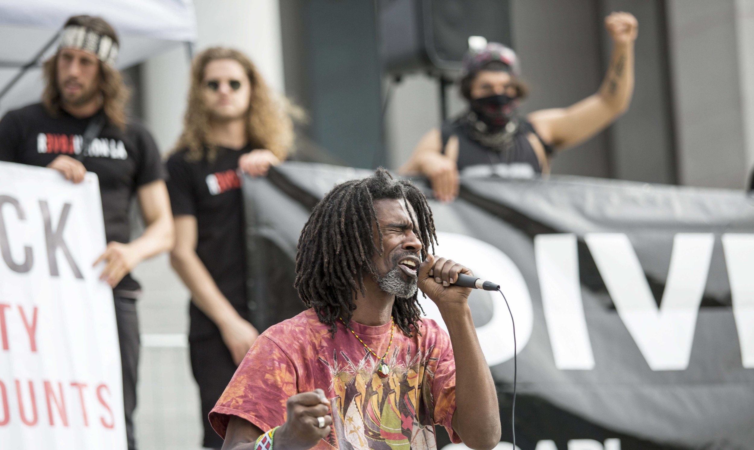  Kor Element, a Bernie Sanders Supporter, World Peace Poet and Hip Hop Healer and NAPL activist performs a spoken word peace at the the Divest LA rally at Los Angles City Hall in Downtown Los Angles, Calif., Friday March 10 2017. Kor Element is photo