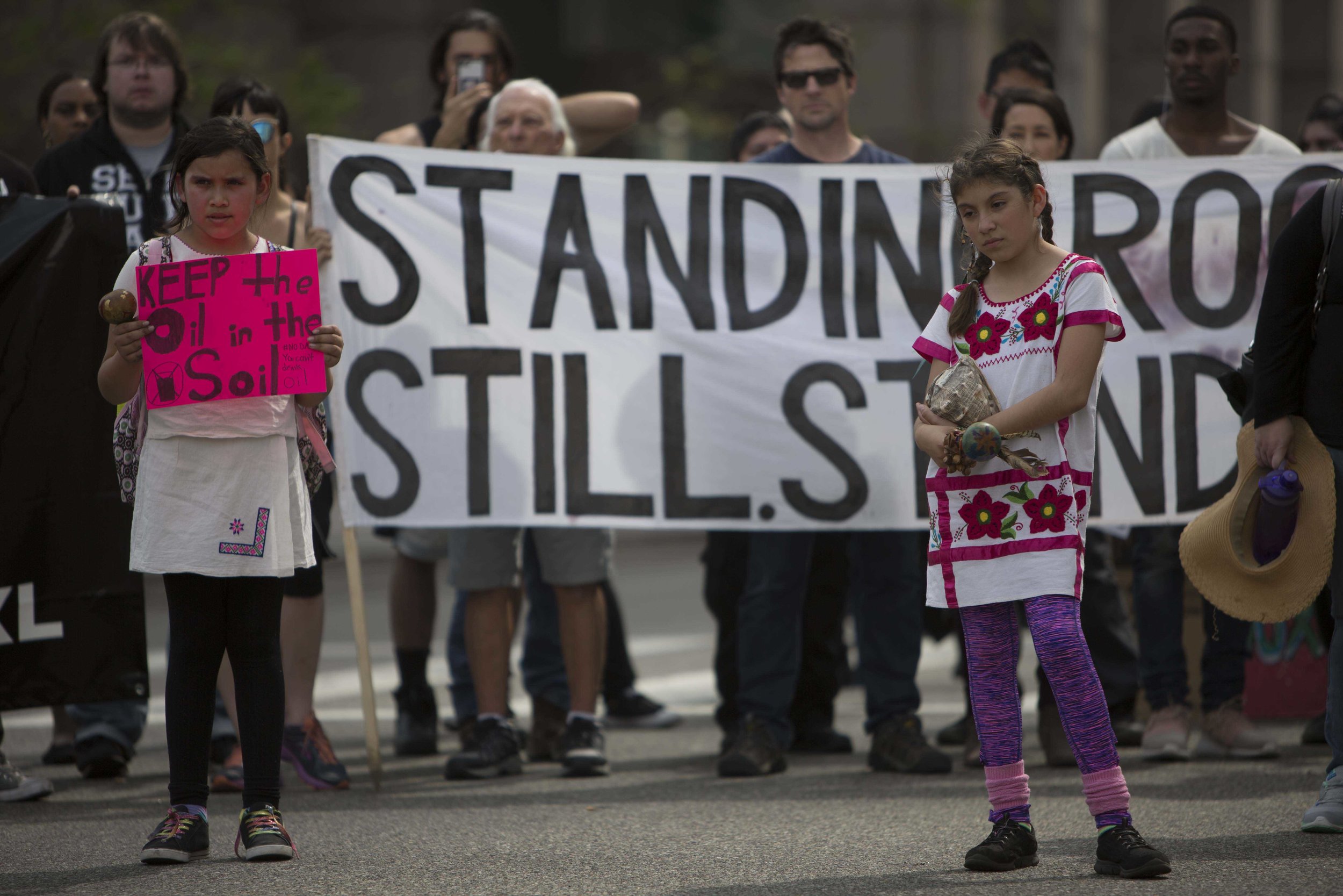  A yound child holdind a sign about wantin no oil drilling near the Dakota Access  Pipeline marching with her friends from Pershing Square to City Hall in Downtown Los Angles, Calif., on Friday March 10, 2017.  Photo by: Daniel/Corsair Staff 