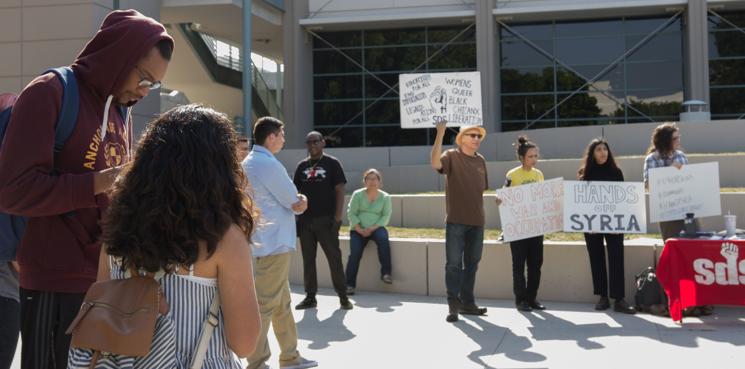  A crowd gathers to gain information and show support at the Hands Off Syria protest at Pasadena City College in Pasadena California on April 11, 2017 (Photo By: Zane Meyer-Thornton) 