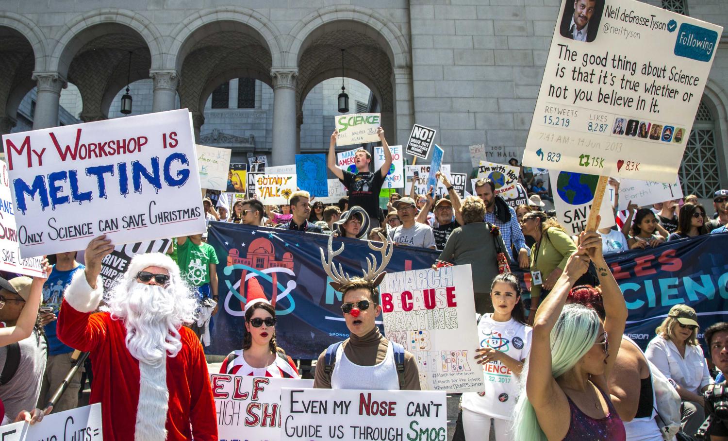  Thousands of protesters arrive at Los Angles City Hall and make their presence felt by chanting and holding up their signs as they wait for key speakers during the March for Science event in downtown Los Angles, California, on Saturday, April 22 201