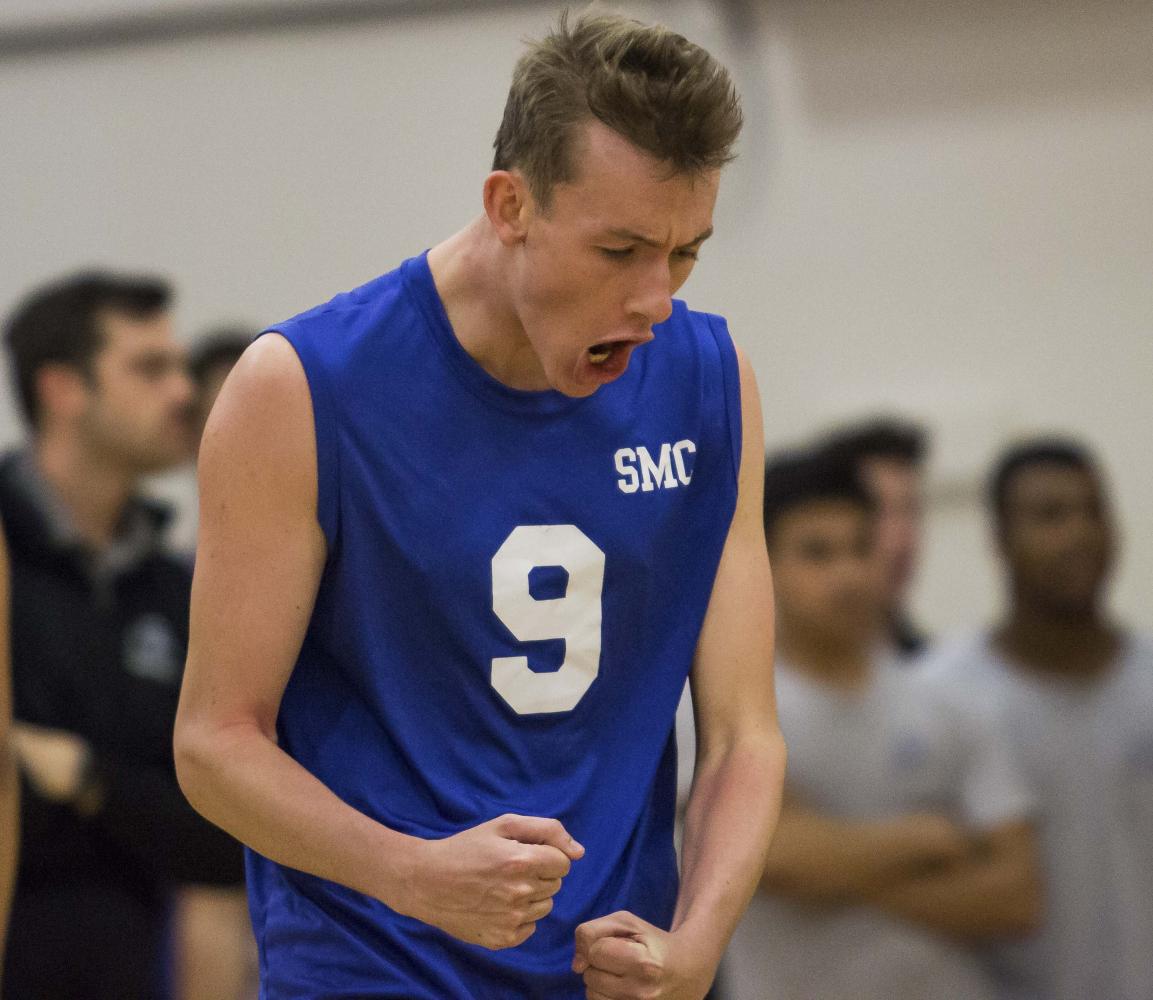  Santa Monica College Corsairs mens volleyball Middle Hitter, Bradley McCallister (9), celebrates a point made by the Corsairs during the Califonia Community College Athletics Association playoff game against the Orange Coast College Pirates at Pierc