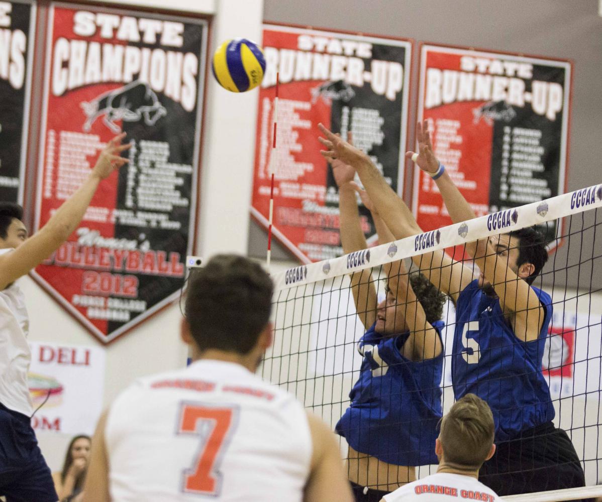  Santa Monica College Corsairs mens volleyball Right side hitter, Shane Stoklos (10), and Middle Hitter, Andrew Dalmada (5) attempt to block an incoming ball durring the Califonia Community College Athletics Association playoff game against the Orang