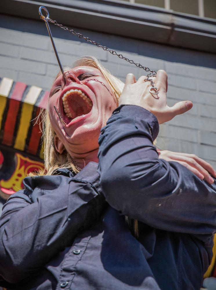  Venice Freakshow performer Morgue performs a mind bending feat in which he shoves a meat hook through his nose and out of his mouth without any harm being done for himself at the Venice Beach Freakshow Farewell Party and Protest in Venice California