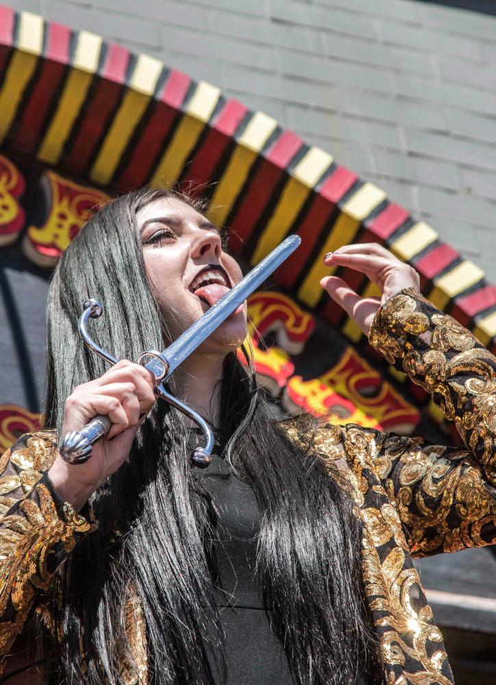     Venice Freakshow performer Morgue performs a mind bending feat in which he shoves a meat hook through his nose and out of his mouth without any harm being done for himself at the Venice Beach Freakshow Farewell Party and Protest in Venice Califor
