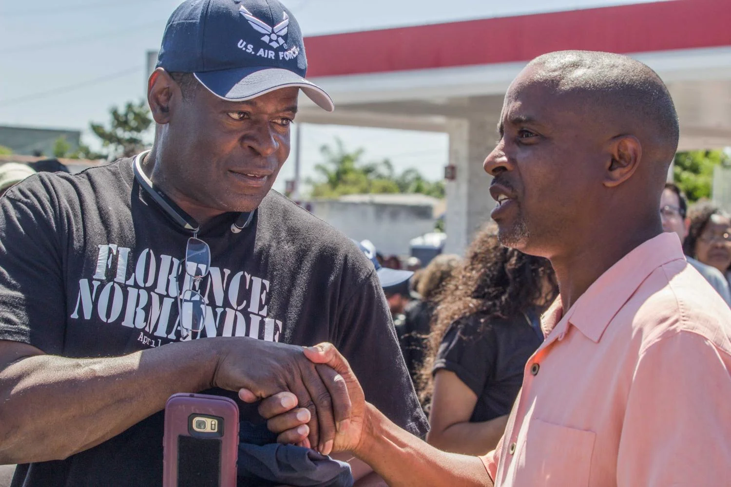 Tim Goldman, whose videos from the inside of the riots have been used all those years by media and police meets Mark Craig, made the Icon of the LA Riots with a front page cover picture on Newsweek 25 years ago. Gathered for the rally march and community festival beginning at the historic intersection of Florence & Normandie where the 1992 Uprising ignited 25 years ago. Photo taken on Saturday April 29th, 2017, in South Los Angeles, Calif. Emeline Moquillon.