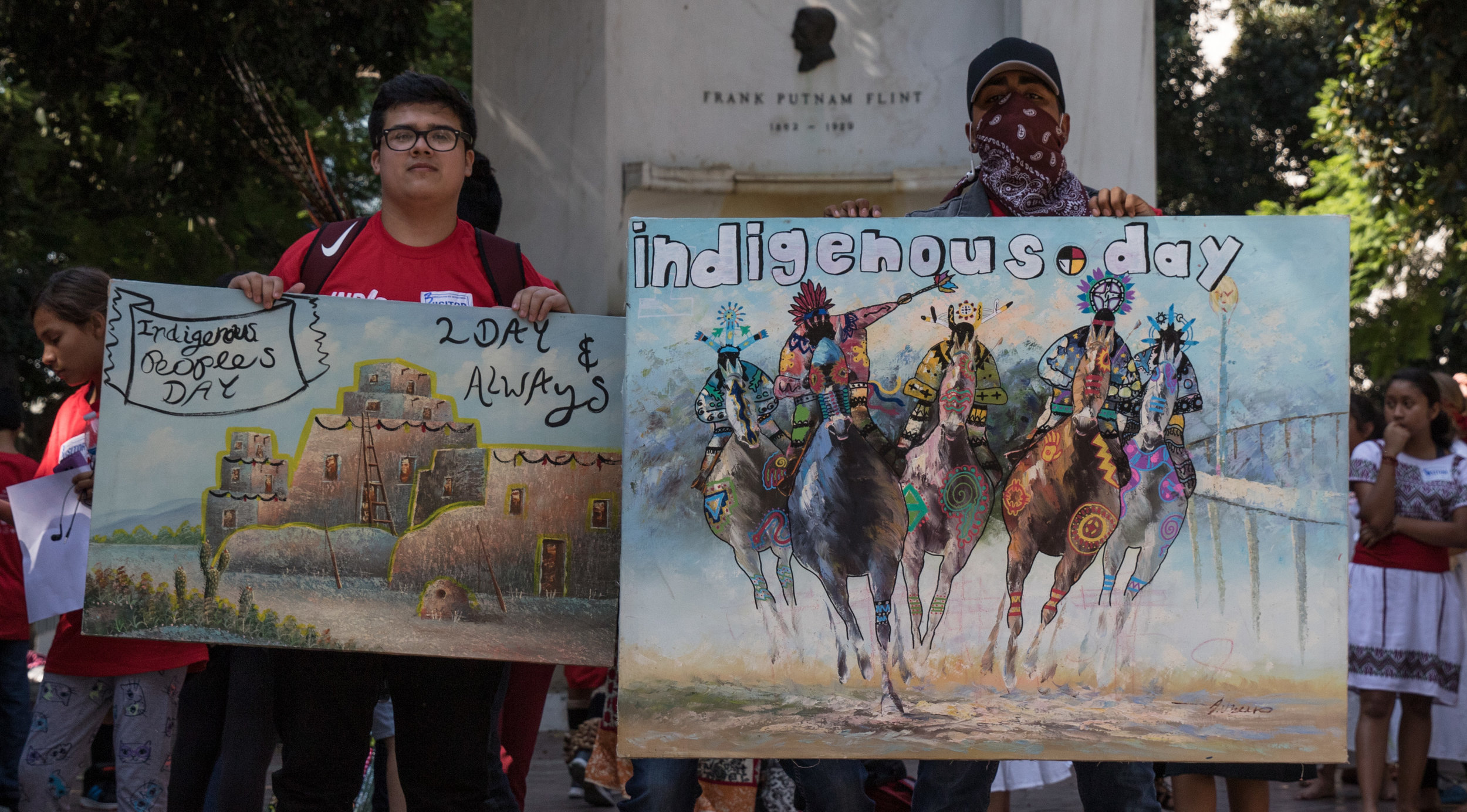  Jaime Arguelles (left) and Isaac Ramirez (right) show off their signs in support of Indigenous Peoples Day replacing Columbus Day on August 30, 2017 at Los Angeles City Hall in Los Angeles California (Photo By: Zane Meyer-Thornton) 