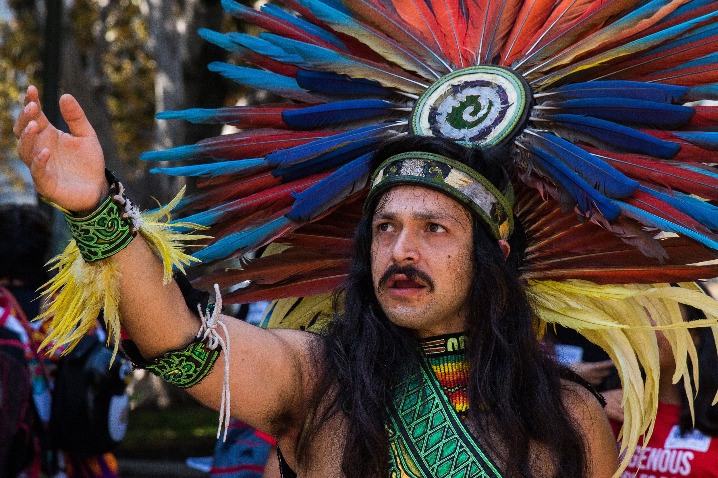  Xochipilli guides his students towards the outside of Los Angeles City Hall due to an overflow of people in the building. This was part of a successful attempt to replace Columbus Day with Indigenous Peoples Day in Los Angeles, California on August 