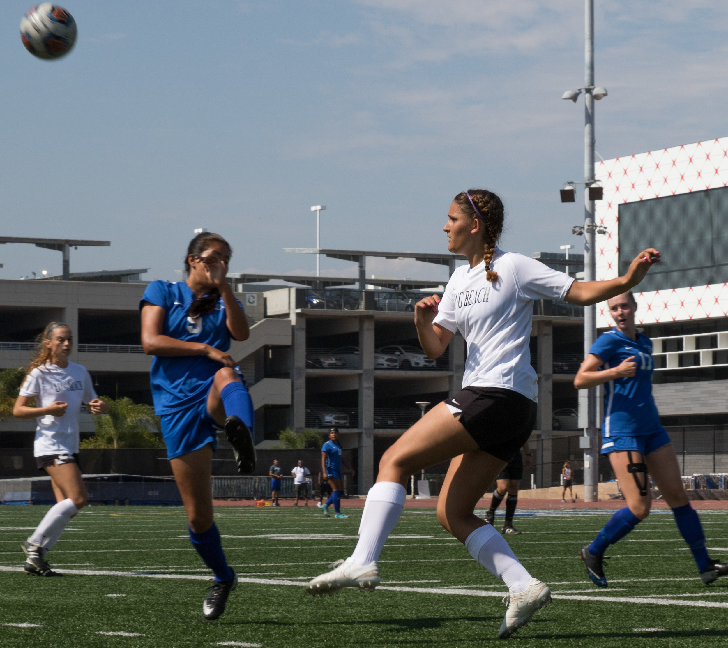  Santa Monica College Corsairs freshman midfielder Ashley Martinez (9, middle) battles for the ball with Long Beach City College Vikings Sophomore Defender Maria Vitiello (right) in their 1-1 draw on August 29, 2017 at the Santa Monica College Footba