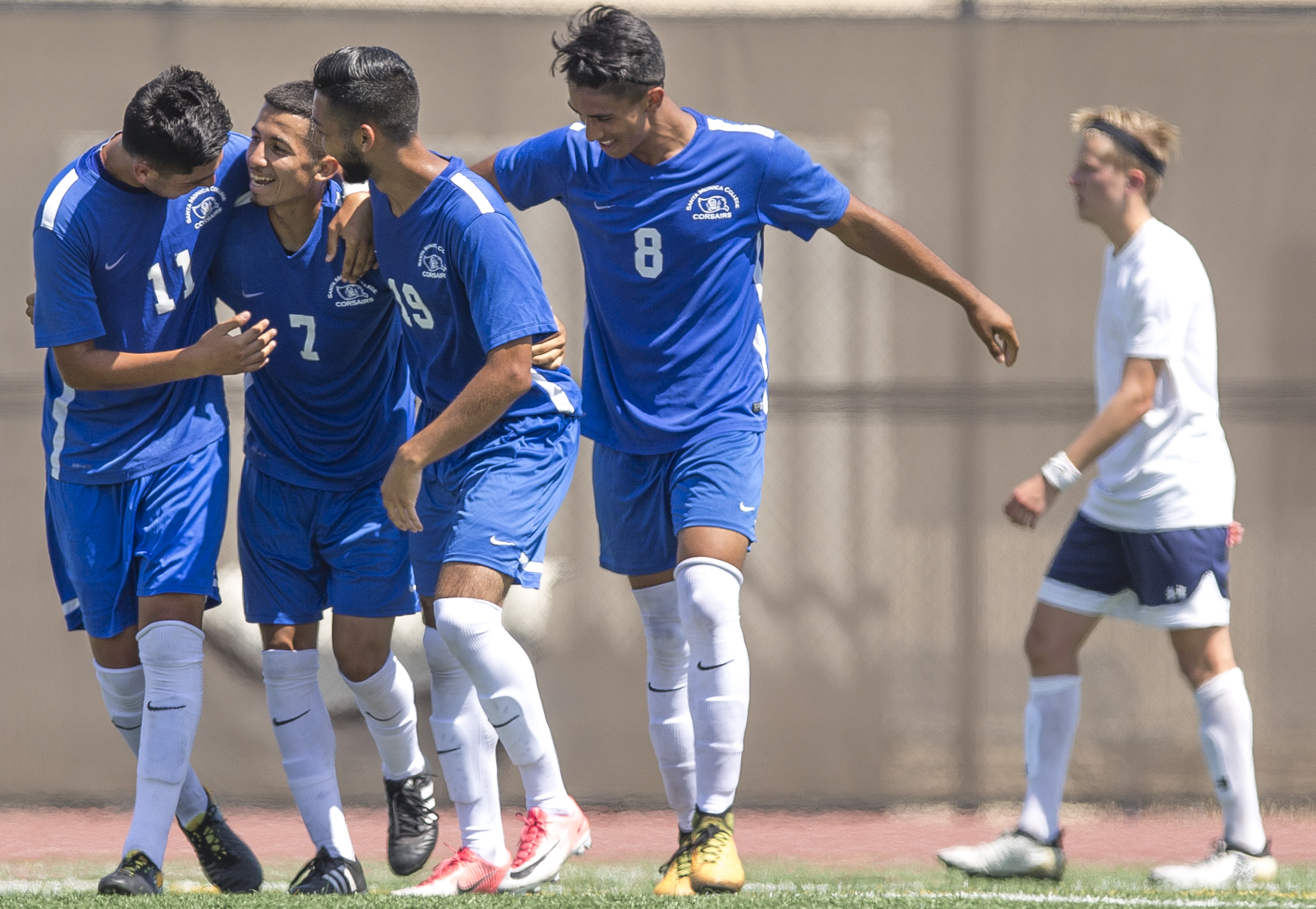  Kevin Martinez (blue,left) (7) of the Santa Monica College Corsairs mens soccer team celebrates a goal against the El Camino College Warriors with his teamates, Friday, September 1st, 2017, at the Santa Monica College Main Campus field in Santa Moni