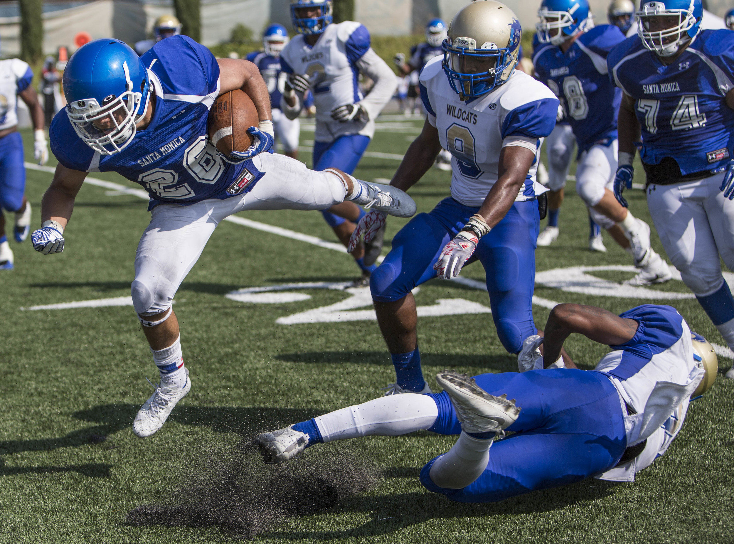  The Santa Monica College Corsairs Mens football Team player wide reciever Terrence Jones II (26) (blue,left) fights for yards after a complted pass against The West La College Wildcats, September 2nd, 2017, at West La College in Culver City, CA. The