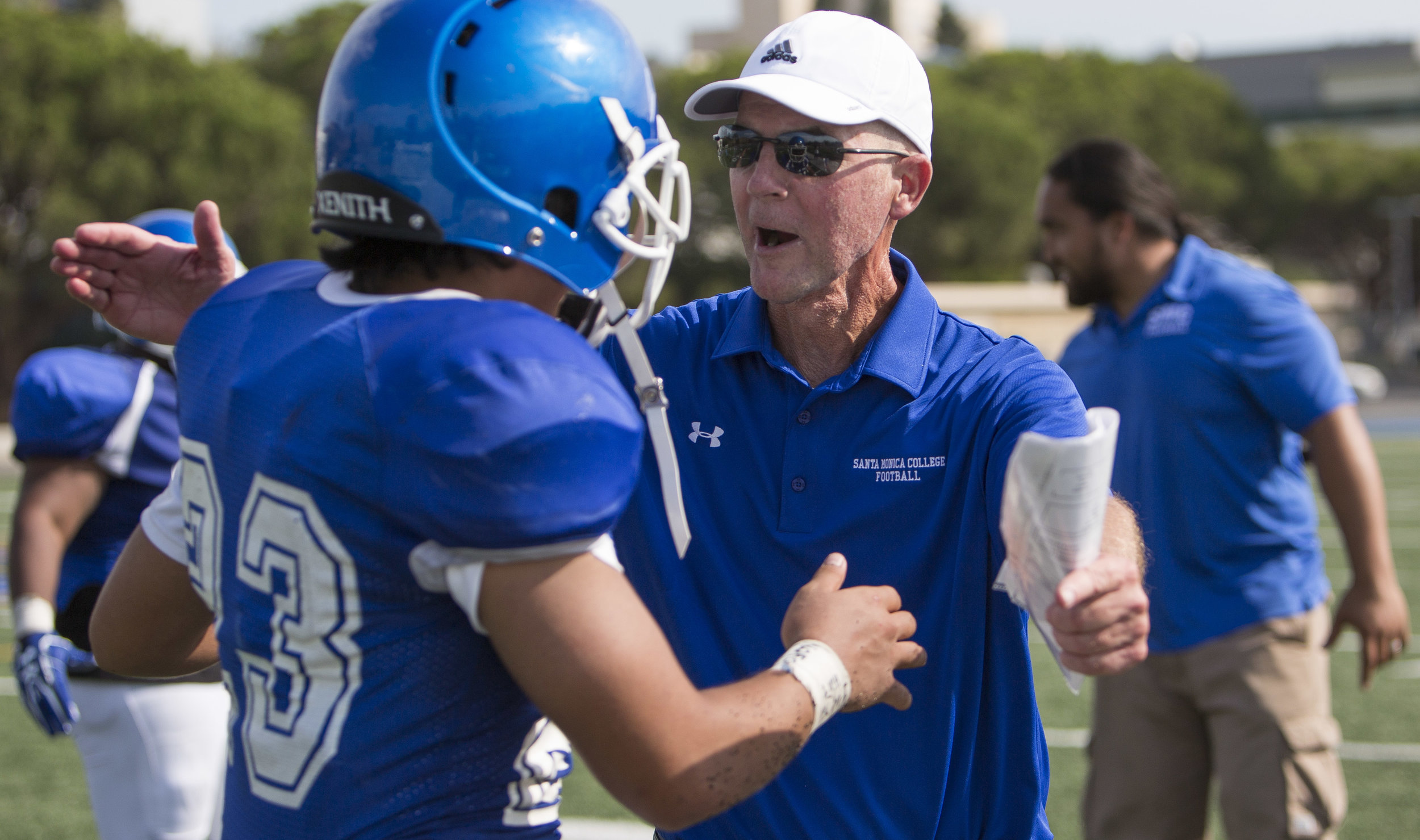  The Santa Monica College Corsairs Mens football head football coach Bill Laslett congradulates player runningback Kahlil Miller (23) (blue,left) after beatingt The West La College Wildcats, Friday, September 2nd, 2017, at West La College in Culver C