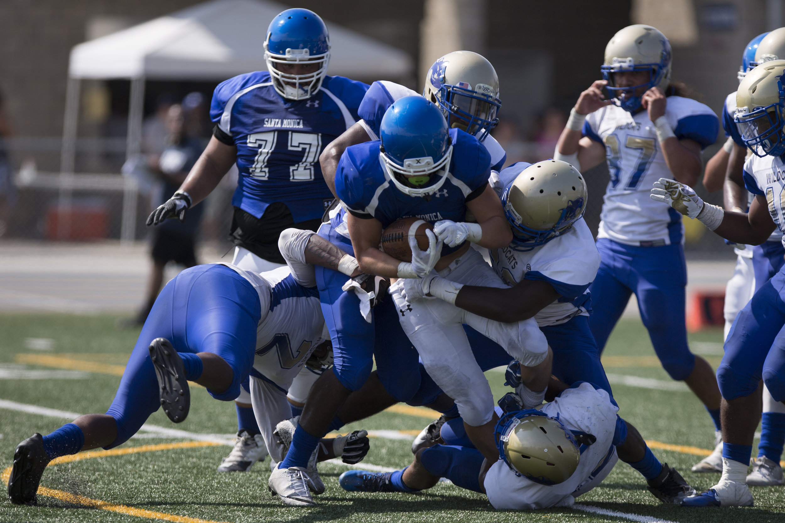  Santa Monica Corsair Christoph Hirota (RB)(5) gets tackled by the West Los Angeles Wildcats on September 2, 2017 at West Los Angeles College in Culver City, California. The Corsairs win their first game against the Wildcats 31-30. (Jose Lopez) 