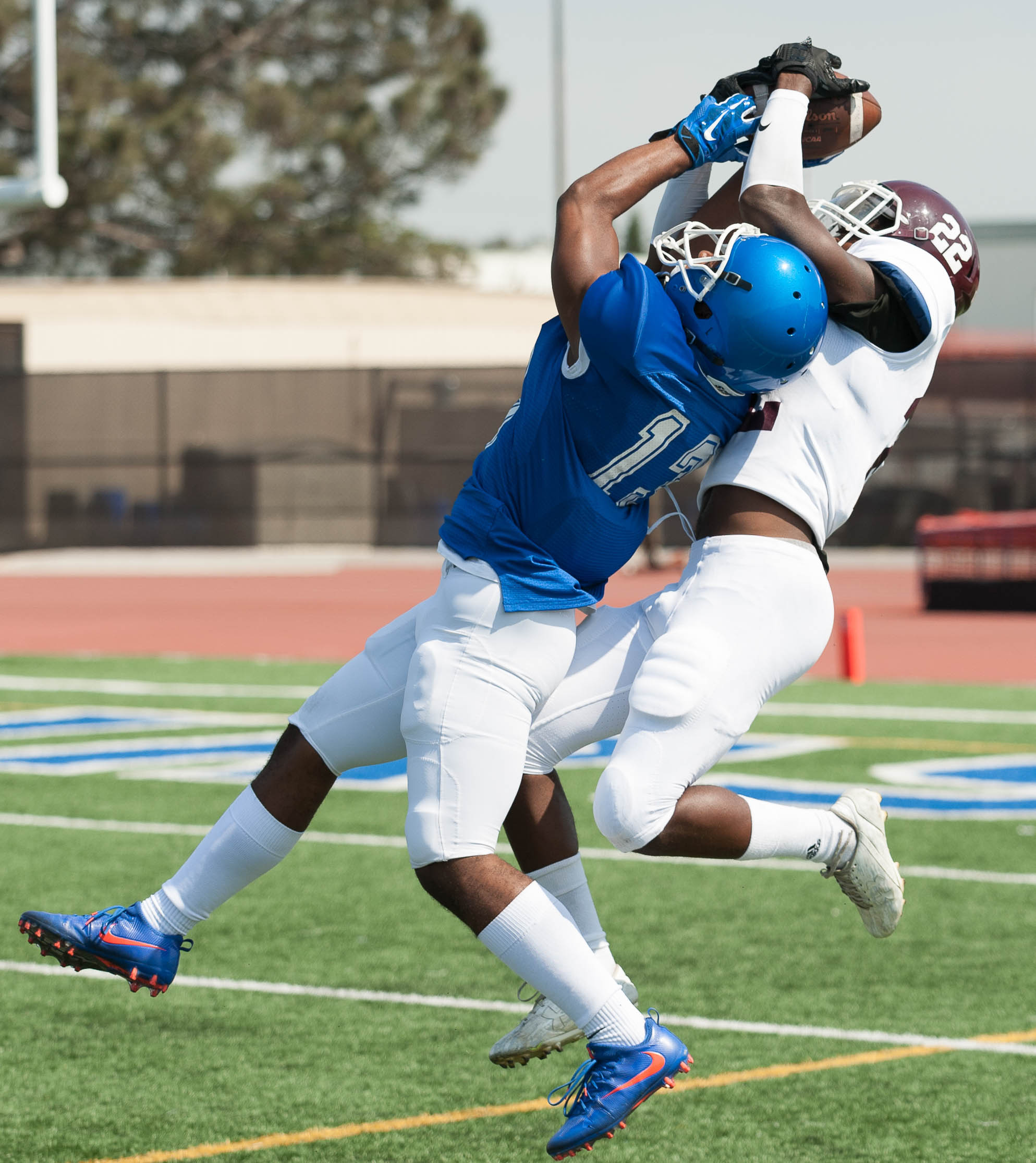  Wide receiver Elijah Boykin (13) of the Santa Monica College makes a contested catch against defensive back Nathaniel Ferguson (22) of Mt. San Antonio College. The Corsairs fell short 6-41 to the Mt. San Antonio Mounties, losing their second game in