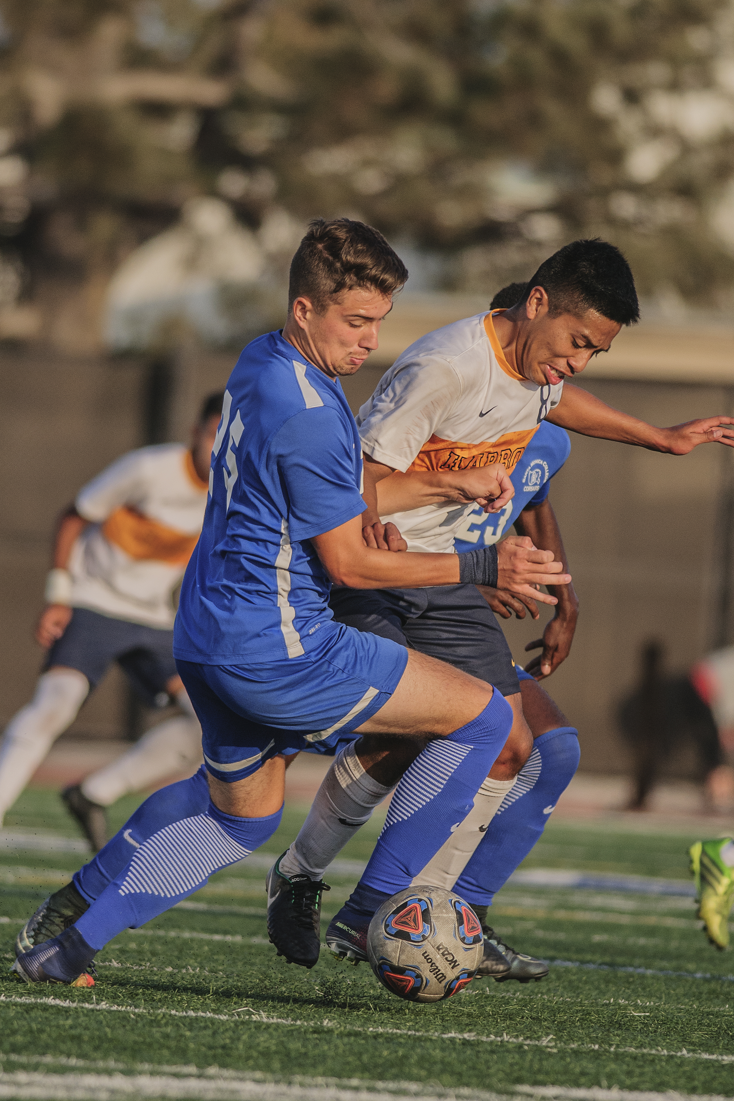  Left Michal Nowakowski from the Santa Monica College mens soccer team along with Luis Coronado from the Los Angeles Harbor College mens soccer team grab hold of each other as they both battle for the soccer ball at Corsair FIeld located on the campu