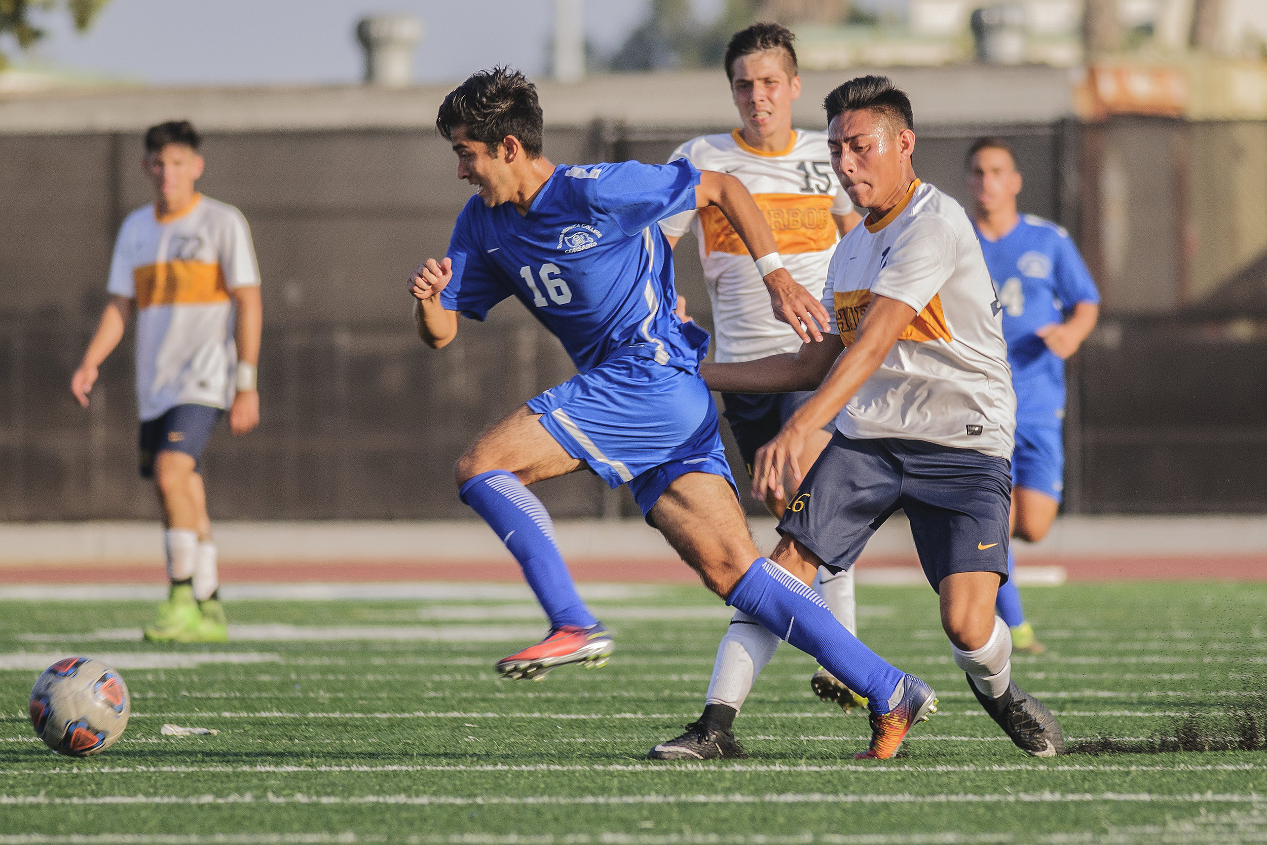  Left Carlos Rincon from the Santa Monica College mens soccer team dribbles the soccer ball around Michael Garcia from the Los Angeles Harbor College mens soccer team in white at corsair field located on the campus of smc on Tuesday September 19th 20