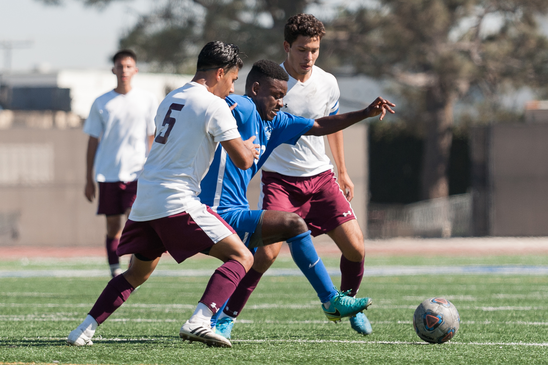  Midfielder Divine Simbu (23,right) of Santa Monica College competes with Angel Barajas (5,left) of Victor Valley College for possession of the ball. The Santa Monica College Corsairs won the game 2-0 against the Victor Valley Rams. The match was hel