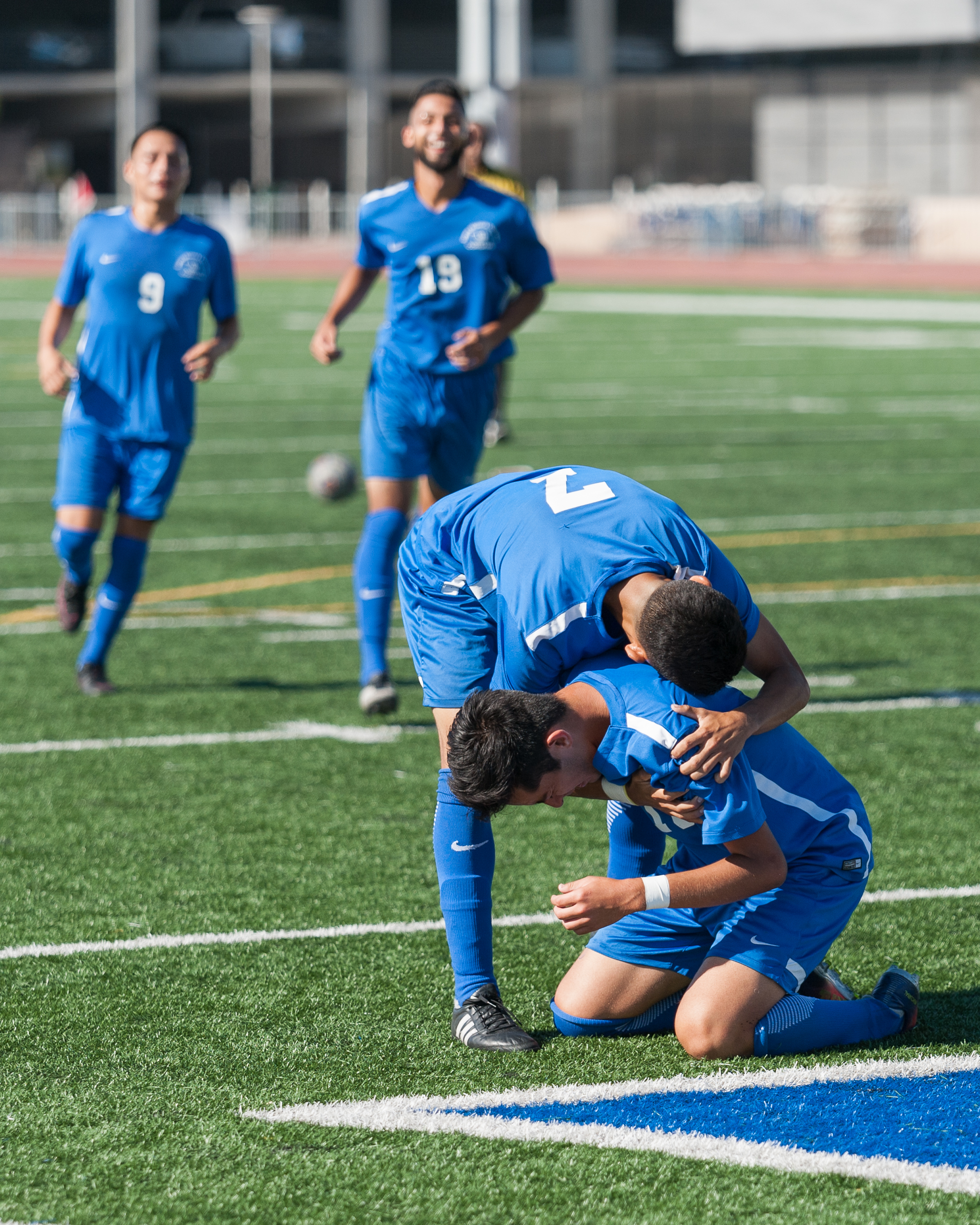  Midfielder Carlos Rincon (16) unleashes his emotions as he is embraced by teammate Kevin Martinez (7) who scored The Corsair's first goal in the a minute prior. Rincon scored the second goal, putting the Corsairs up 2-0 against Victor Valley at the 