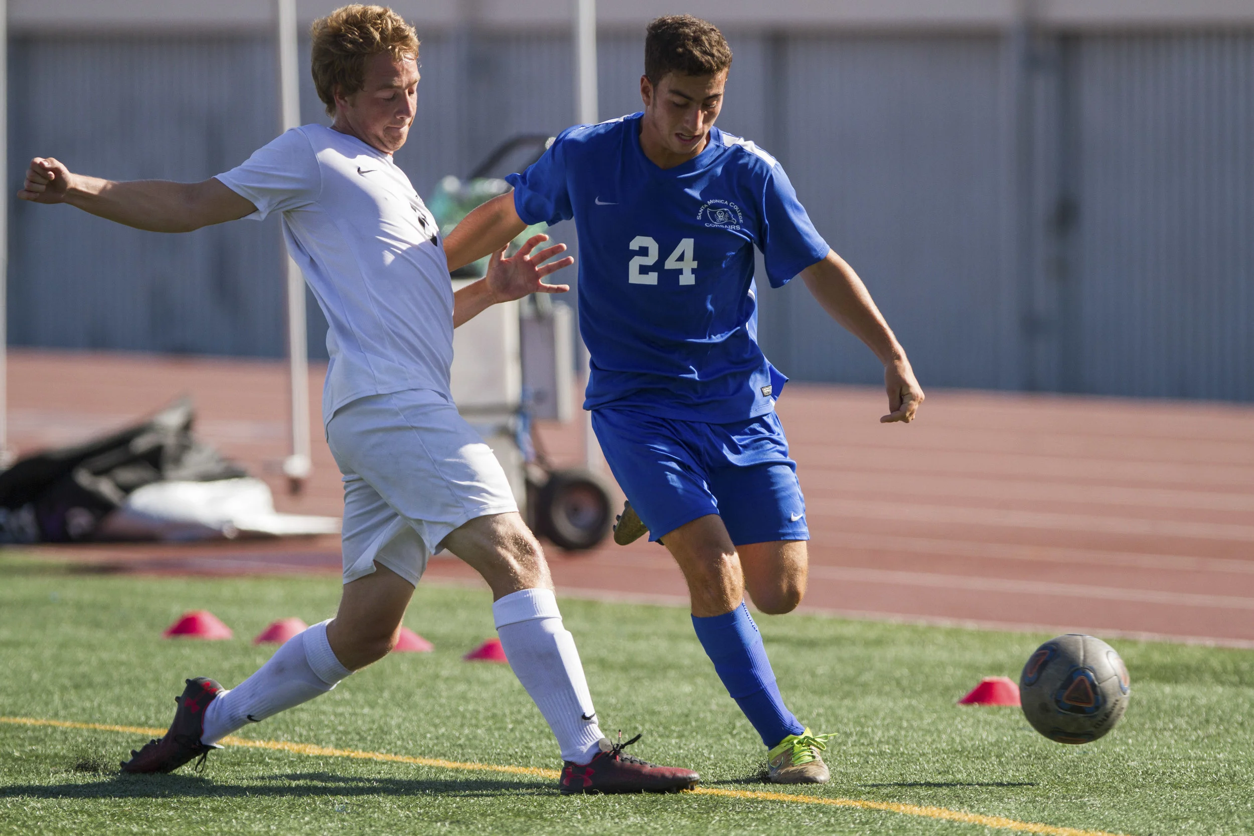  Santa Monica College Corsair Yoel Cohavy (24) (R) fights for possession of the ball against Moorpark College Raider Nathaniel Johnson (2) (L) on Tuesday, October 10, 2017, on the Corsair Field at Santa Monica College in Santa Monica, California. The