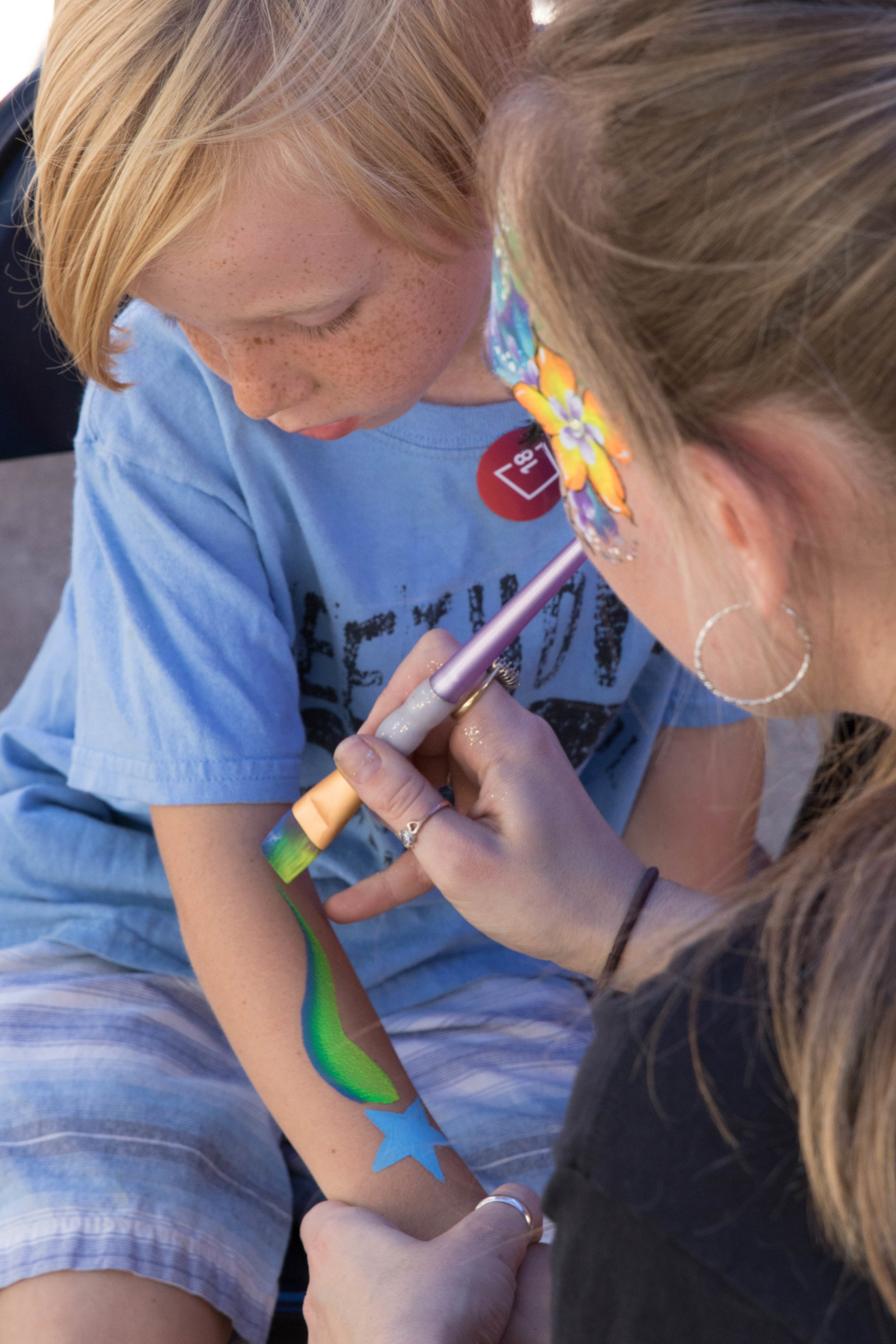  Rylan Boothby (left) gets an arm drawing done by Oriana as part of the Pico Block Party on October 14, 2017 (Photo By: Zane Meyer-Thornton) 