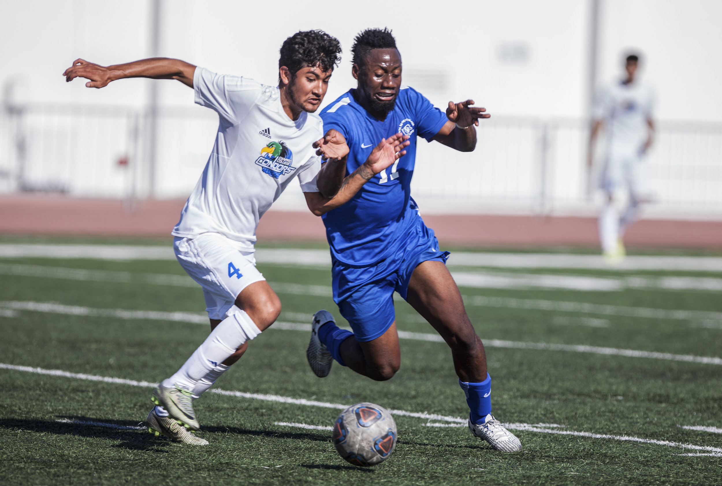  Cyrille Njomo (17) of the Santa Monica College tries to withdraw the ball from Benjamin Garcia (4) of Oxnard College. The Santa Monica College Corsairs won the game 2-0 against the Oxnard College. The match was held at the Corsair Stadium in Santa M