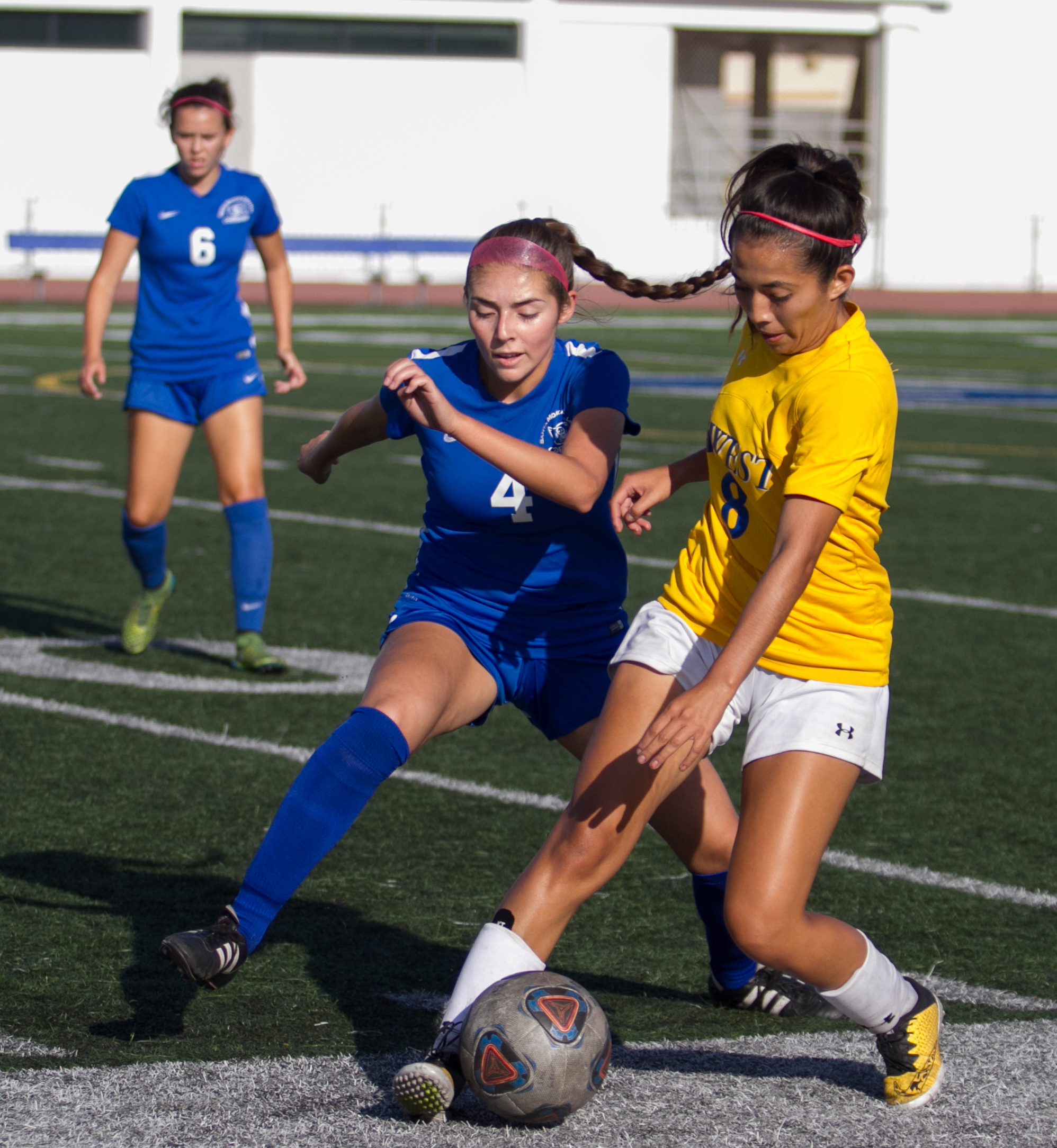  Santa Monica College Corsair Paulina Salas (4)(L) fights for possession of the ball against West LA College Wildcat Lincy Villatoro (8)(R) on Tuesday, October 17, 2017, on the Corsair Field at Santa Monica College in Santa Monica, California. The Co