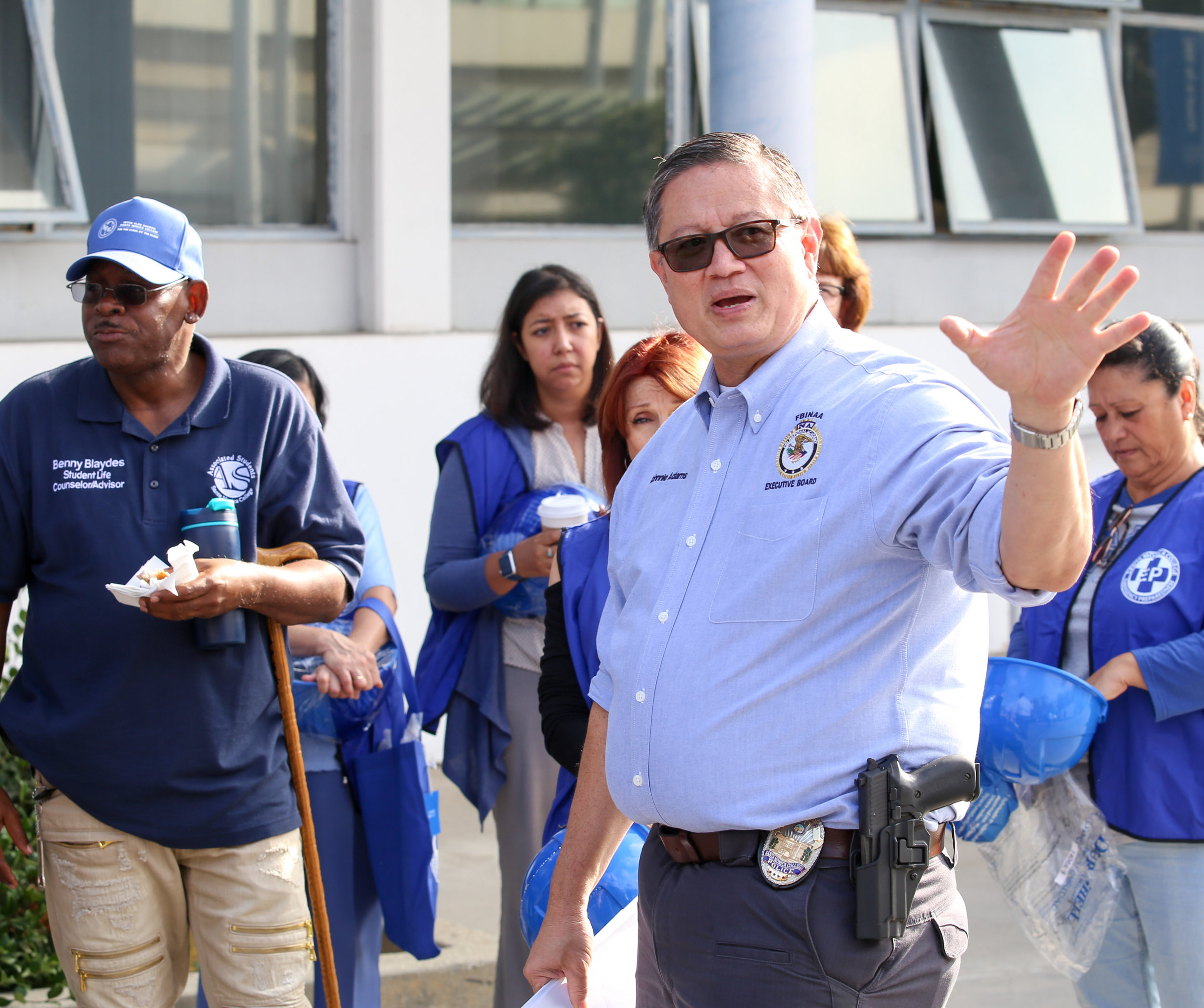  Santa Monica College's Chief of Police Johnnie Adams explains to building monitors and Student Life Counselor and Advisor Benny Blaydes (left) the protocol for submitting their reports back to their command center set up outside of Santa Monica Coll