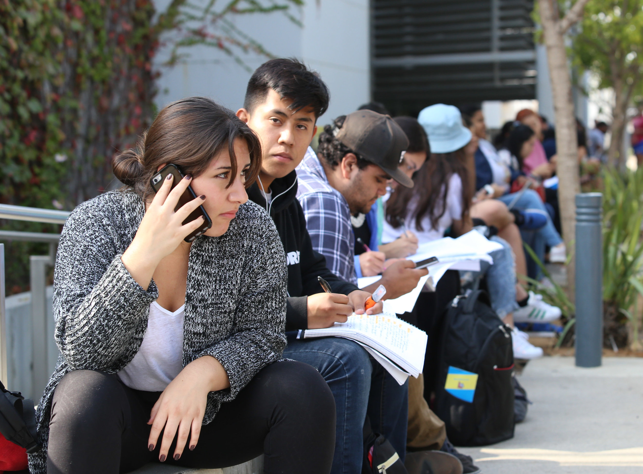  Students wait outside of Santa Monica College's Main Campus Library doing school work after being evacuated for the Great California Shakedown drill in Santa Monica, Calif on Thursday, October 19th 2017. (Photo by: Thane Fernandes) 